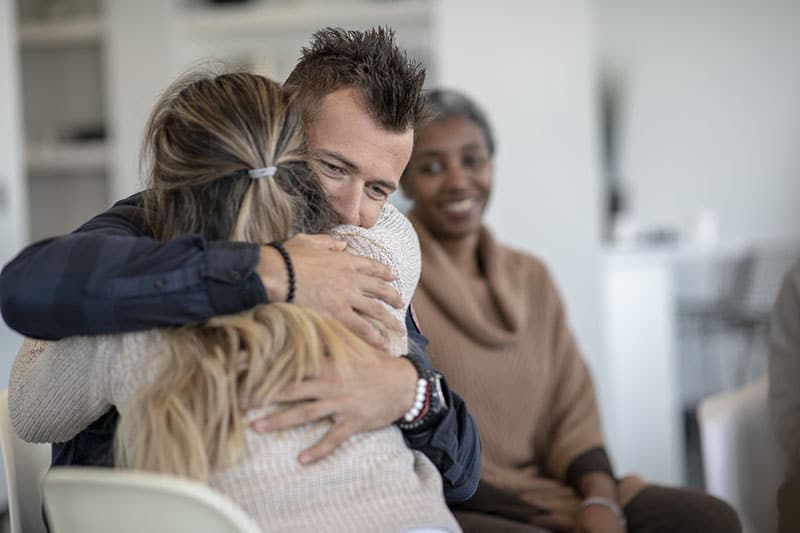 Man and Women Hugging